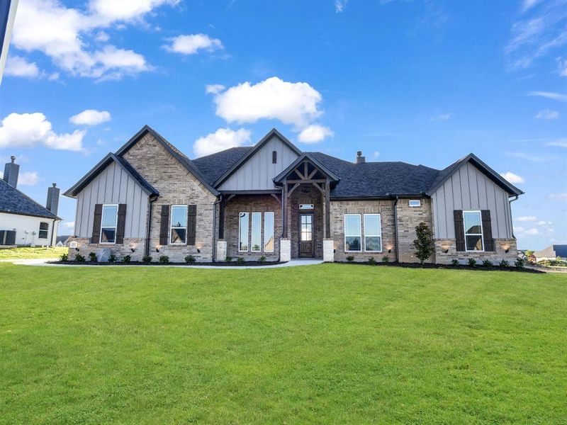 Modern farmhouse with central AC unit and a front lawn