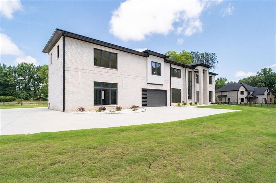 Front exterior of a new home in , Lawrenceville, GA, highlighting curb appeal (Image 26). Front exterior of a new home in , Lawrenceville, GA, highlighting curb appeal (Image 26).