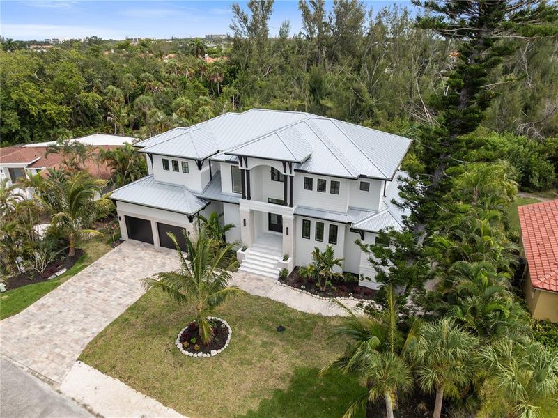 Front exterior of a new home in , Longboat Key, FL, highlighting curb appeal (Image 29). Front exterior of a new home in , Longboat Key, FL, highlighting curb appeal (Image 29).