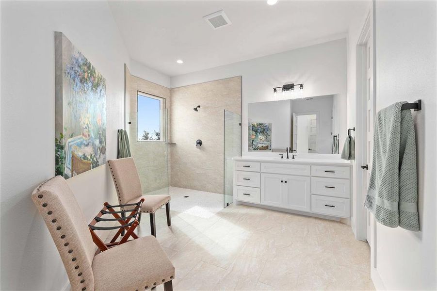 Full bathroom with vanity, a walk in shower, and recessed lighting