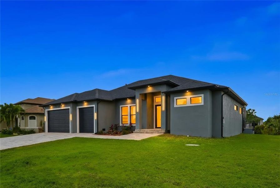 Front exterior of a new home in , Port Charlotte, FL, highlighting curb appeal (Image 27). Front exterior of a new home in , Port Charlotte, FL, highlighting curb appeal (Image 27).