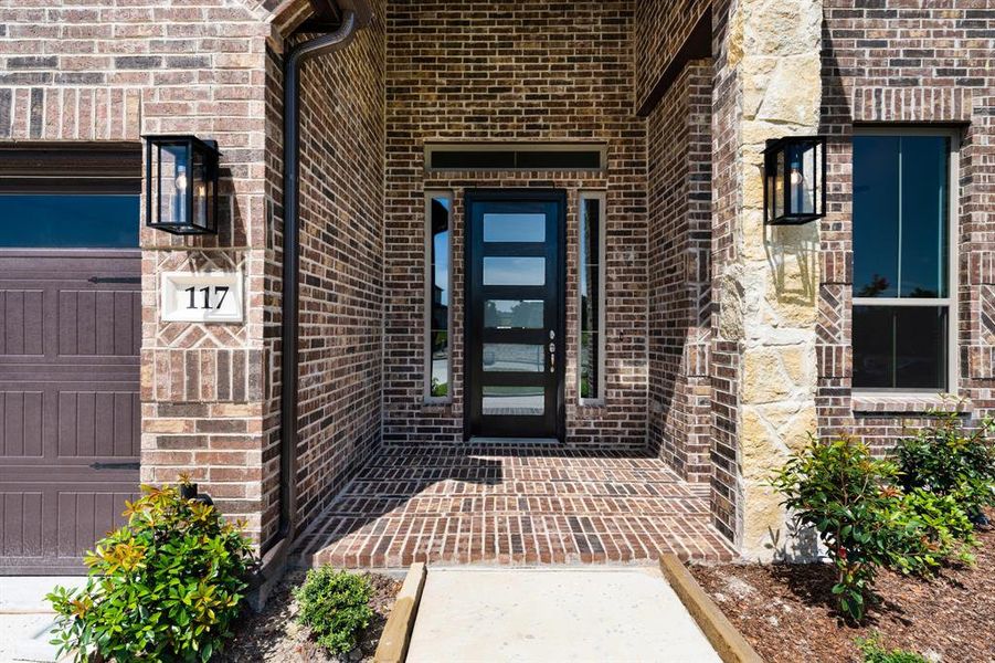 Inviting brick entry with a beautiful paneled door. Inviting brick entry with a beautiful paneled door.