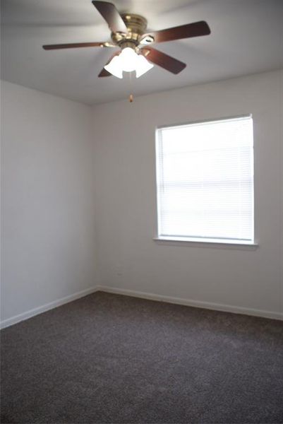 One of the 3 bedrooms with nice natural light.
