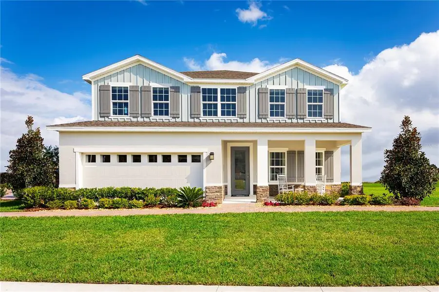 Front exterior of a new home in The Crossings, St. Cloud, FL, highlighting curb appeal (Image 1).