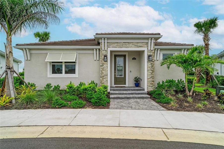 Front exterior of a new home in Esplanade at Azario Lakewood Ranch, Lakewood Ranch, FL, highlighting curb appeal (Image 23). Front exterior of a new home in Esplanade at Azario Lakewood Ranch, Lakewood Ranch, FL, highlighting curb appeal (Image 23).