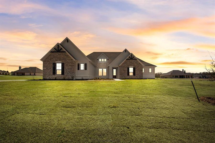 Front exterior of a new home in King Crossing Estates, Van Alstyne, TX, highlighting curb appeal (Image 18). Front exterior of a new home in King Crossing Estates, Van Alstyne, TX, highlighting curb appeal (Image 18).