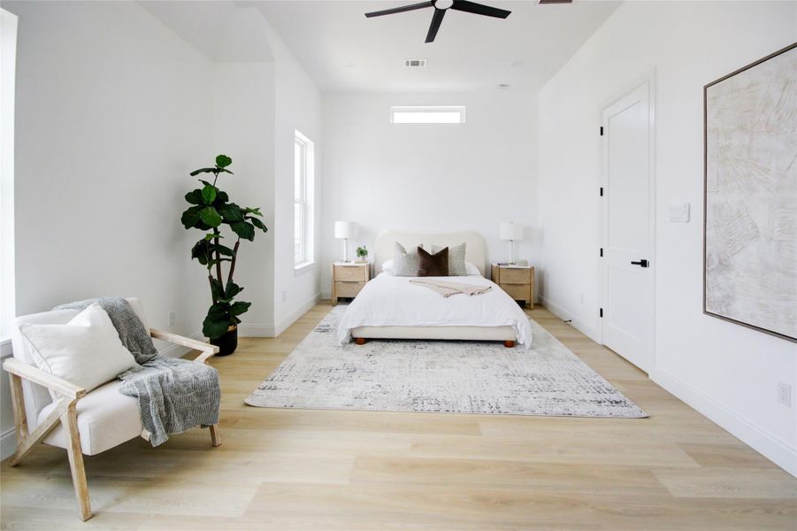 This primary suite is grand! Between the high ceilings, the space, and the natural light, we don't know what our favorite thing about it is! This primary suite is grand! Between the high ceilings, the space, and the natural light, we don't know what our favorite thing about it is!