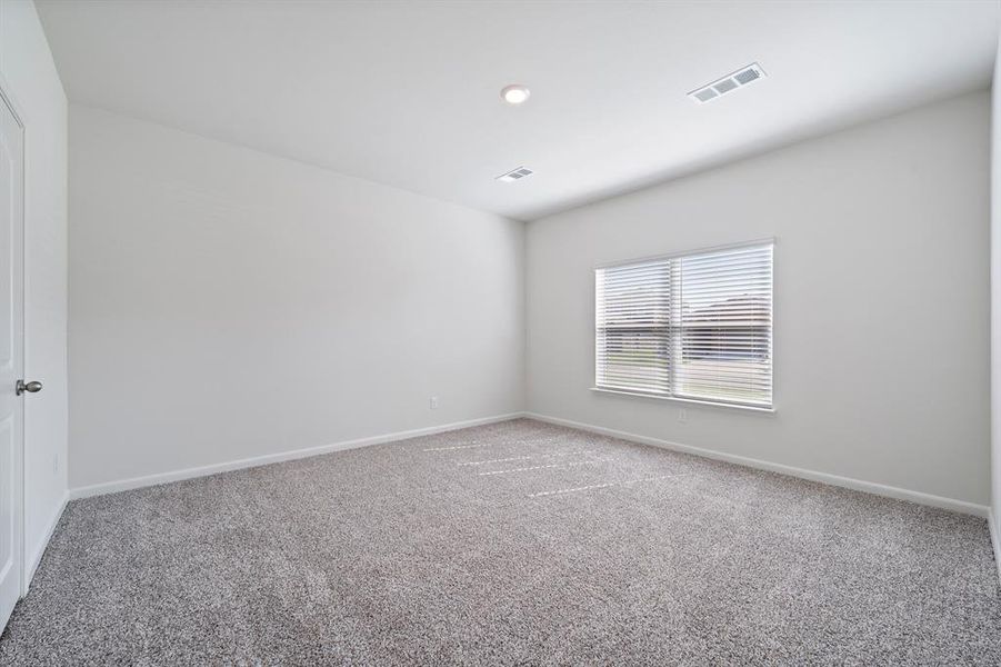 Unfurnished room with carpet