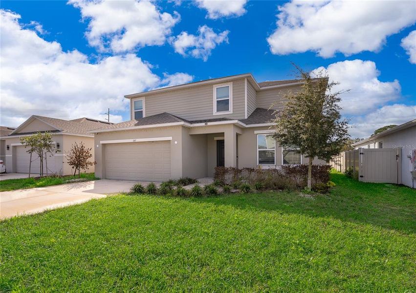 Front exterior of a new home in Marion Creek, Haines City, FL, highlighting curb appeal (Image 17). Front exterior of a new home in Marion Creek, Haines City, FL, highlighting curb appeal (Image 17).