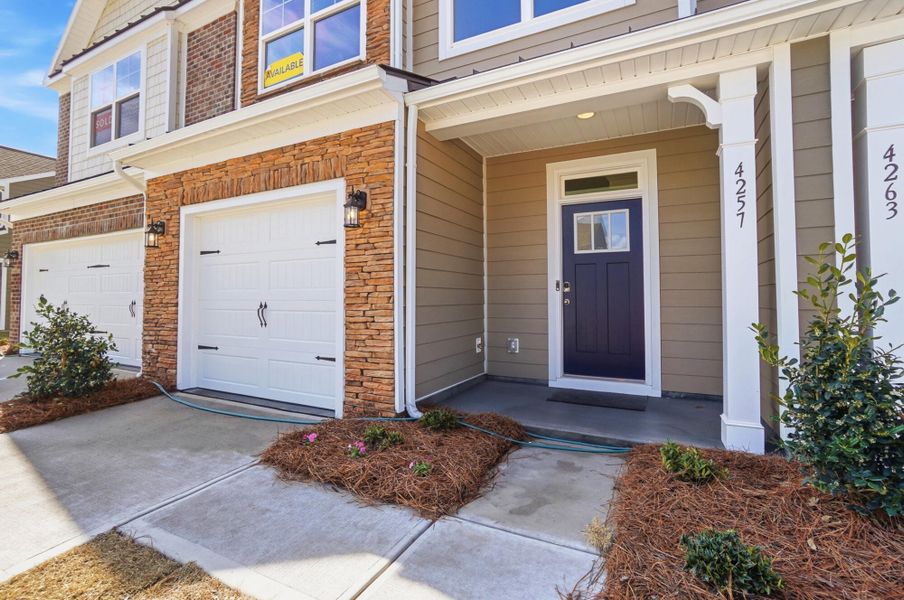 Exterior details and patio area of a home in Harrisburg Village Townhomes, Harrisburg (Image 3).