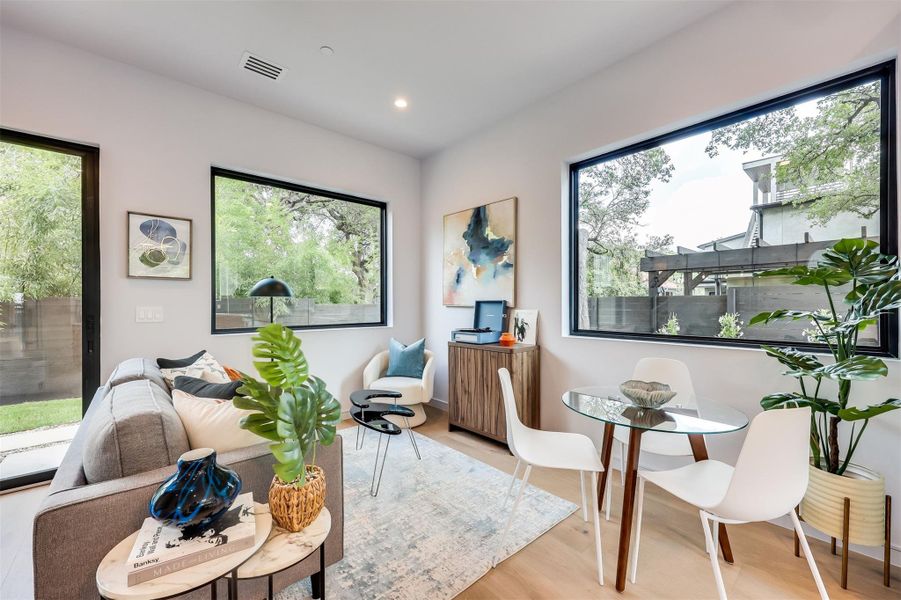 Step straight into the flow; no corridors, just wide white oak floors and 10-foot ceilings that let the room breathe and catch every bit of natural light