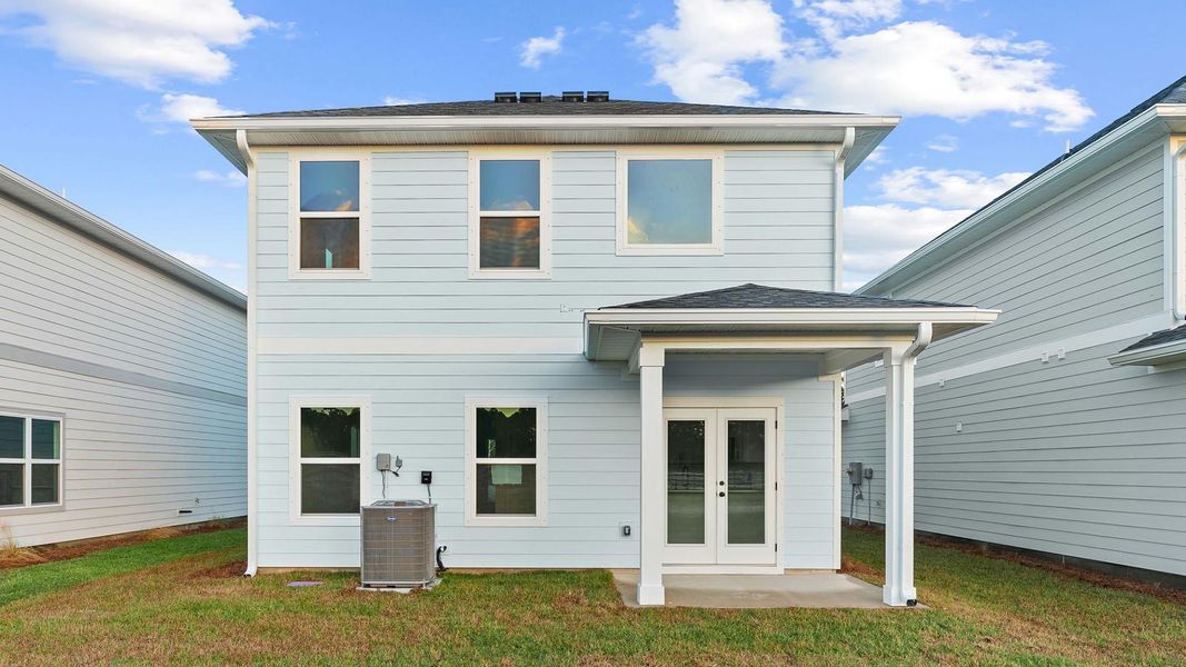 Exterior details and patio area of a home in Colonial East, Panama City Beach (Image 4).