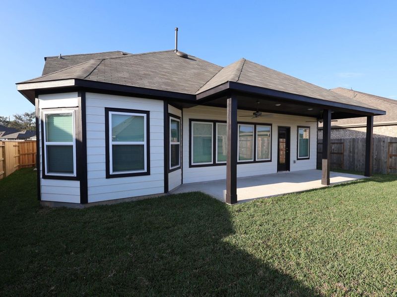 Exterior details and patio area of a home in Pinewood at Grand Texas, New Caney (Image 3).