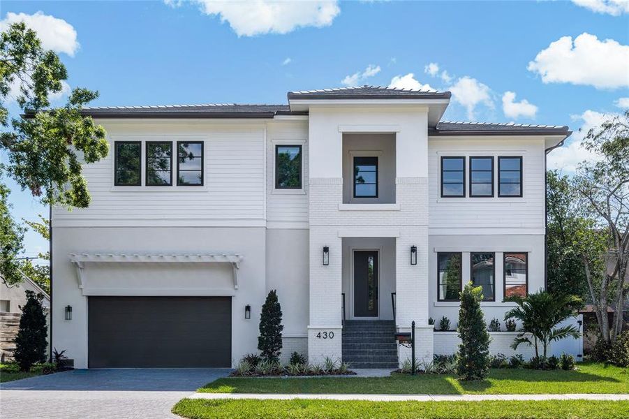 Front exterior of a new home in , Tampa, FL, highlighting curb appeal (Image 1).