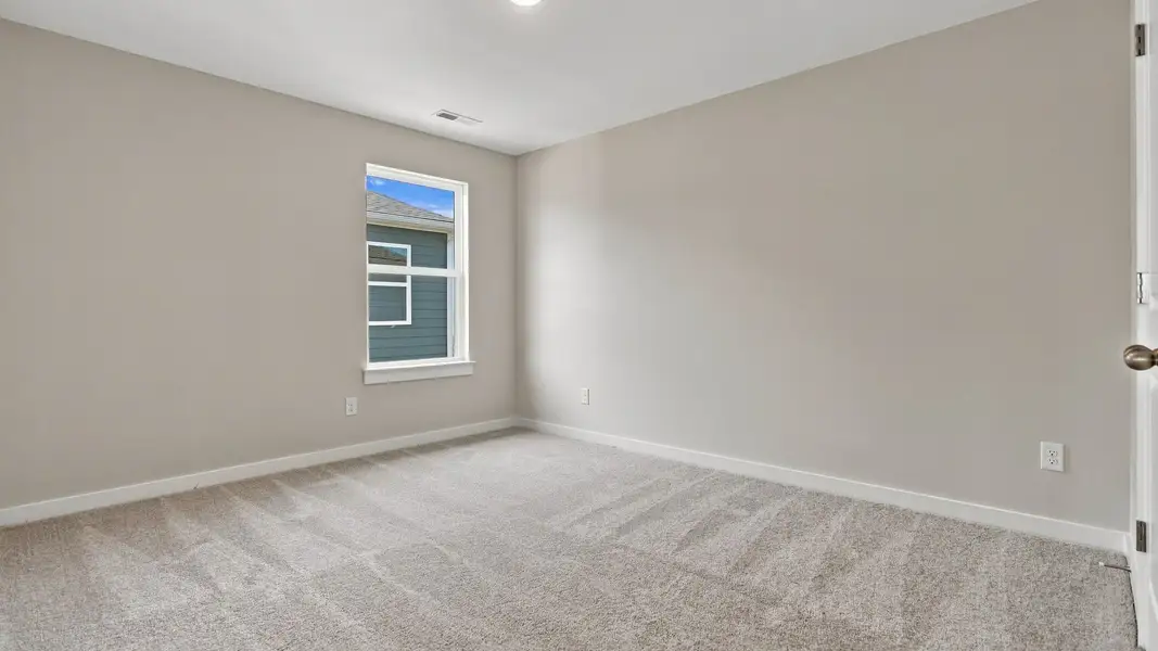 Other secondary bedroom with window across from closet and room entrance Other secondary bedroom with window across from closet and room entrance