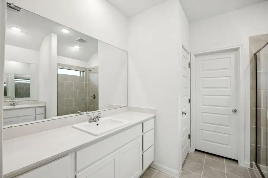 Primary Bathroom in the Spruce home plan by Trophy Signature Homes - REPRESENTATIVE PHOTO