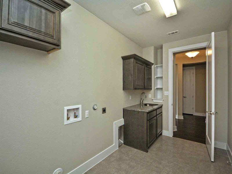 Representative furnished interior of a home built from the Madera II by Giddens Homes in Scofield Farms Estates, Georgetown (Image 273).