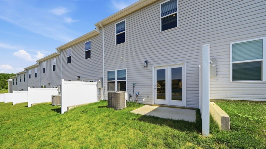 Exterior details and patio area of a home in The Arbor Townhomes, Kingsport (Image 4).