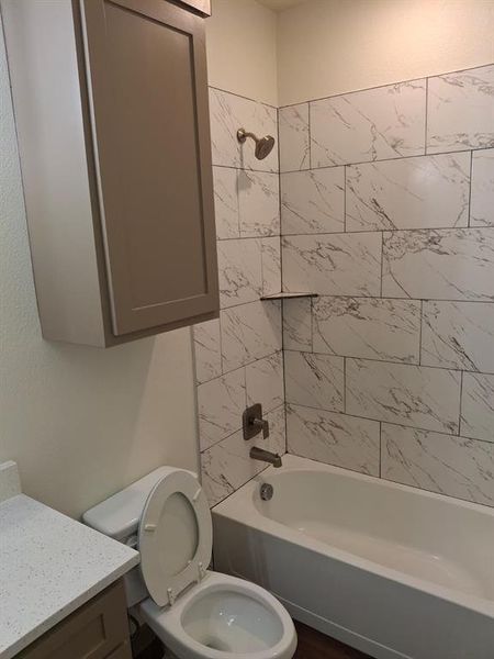 Full bath featuring bathing tub / shower combination and vanity Full bath featuring bathing tub / shower combination and vanity