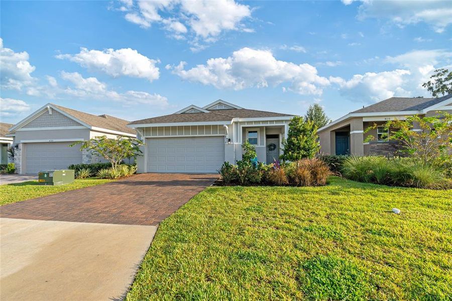 Front exterior of a new home in Ocala Preserve, Ocala, FL, highlighting curb appeal (Image 22).