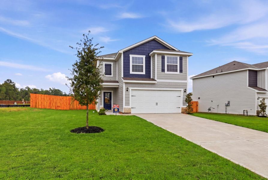 Front exterior of a new home in Magnolia Woods, Magnolia, TX, highlighting curb appeal (Image 2). Front exterior of a new home in Magnolia Woods, Magnolia, TX, highlighting curb appeal (Image 2).