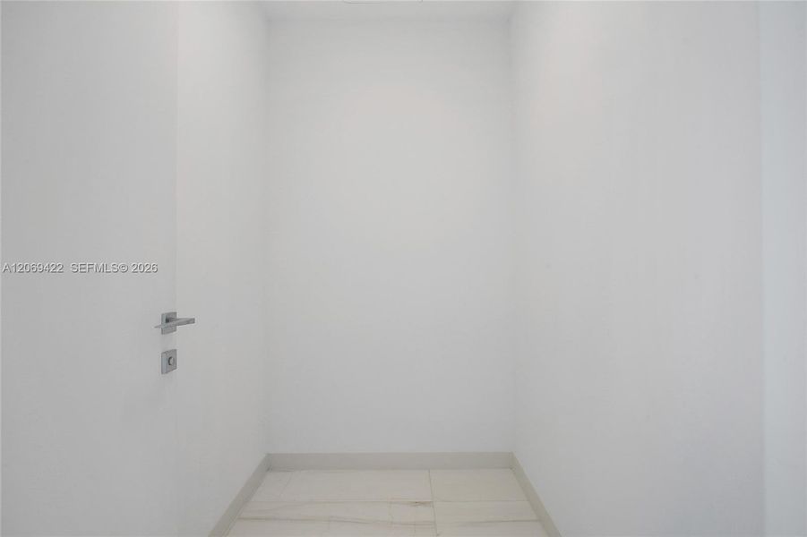 Spacious, unfurnished interior of a new home in Aston Martin Residences, Miami (Image 16). Spacious, unfurnished interior of a new home in Aston Martin Residences, Miami (Image 16).