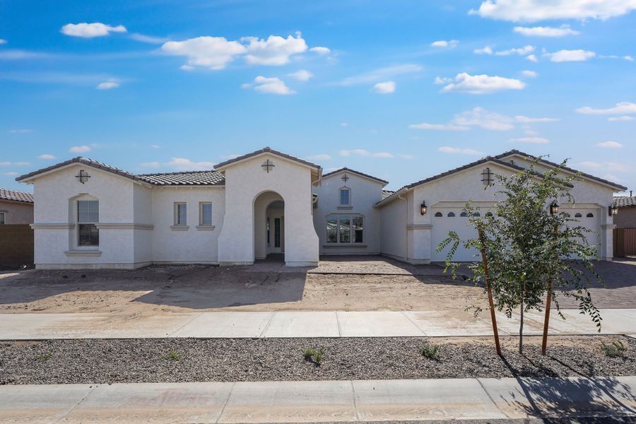 Front exterior of a new home in Ellsworth Ranch, Queen Creek, AZ, highlighting curb appeal (Image 1). Front exterior of a new home in Ellsworth Ranch, Queen Creek, AZ, highlighting curb appeal (Image 1).