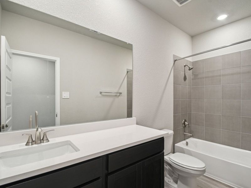 Furnished interior view inside a new home in Riverbend at Double Eagle - Boulevard Collection, Cedar Creek (Image 4).