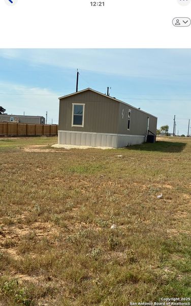 Exterior details and patio area of a home in , Atascosa (Image 3).