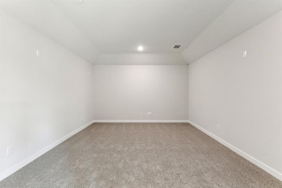 Media Room in the Wimbledon home plan by Trophy Signature Homes – REPRESENTATIVE PHOTO