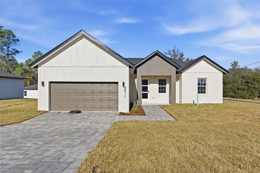 Front exterior of a new home in , Ocala, FL, highlighting curb appeal (Image 18).