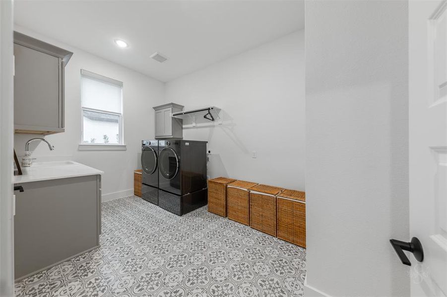 I love this laundry room!  I love the sink, the storage and the tile!  You could add additional shelving, a refrigerator, folding table or an easy chair!