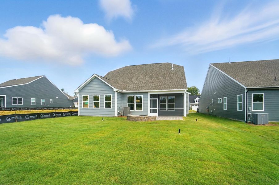 Front exterior of a new home in Heritage - 55+ Community, Indian Trail, NC, highlighting curb appeal (Image 29). Front exterior of a new home in Heritage - 55+ Community, Indian Trail, NC, highlighting curb appeal (Image 29).