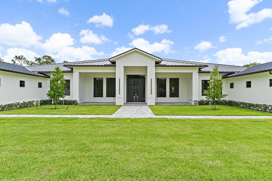 Front exterior of a new home in , Jupiter, FL, highlighting curb appeal (Image 29).