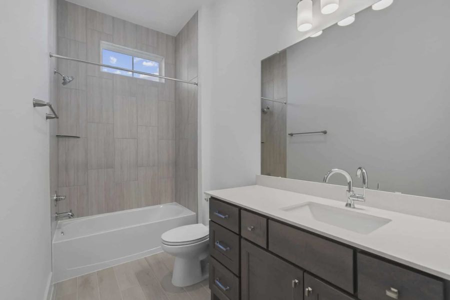 Representative furnished interior of a home built from the Waterford by Chesmar Homes in Meridiana 60's, Manvel (Image 15).