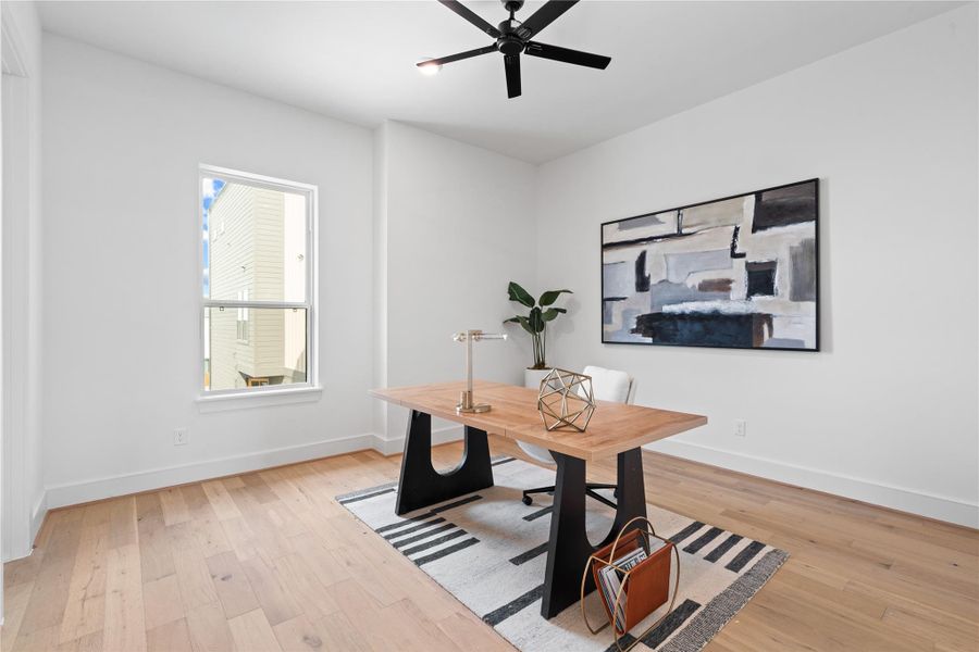 Spacious secondary bedroom on the second floor, perfect for use as a guest room, home office, or flex space to suit your lifestyle needs.