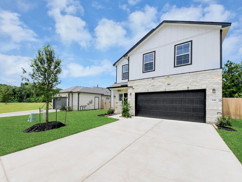 Front exterior of a new home in Caney Creek Place, Conroe, TX, highlighting curb appeal (Image 20).