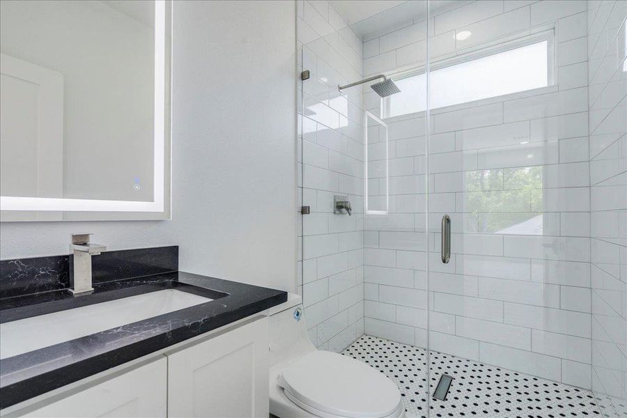 Full bath featuring vanity and stand up shower