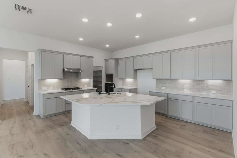 Representative furnished interior of a home built from the Shea by Chesmar Homes in The Crossvine, Forney (Image 3).