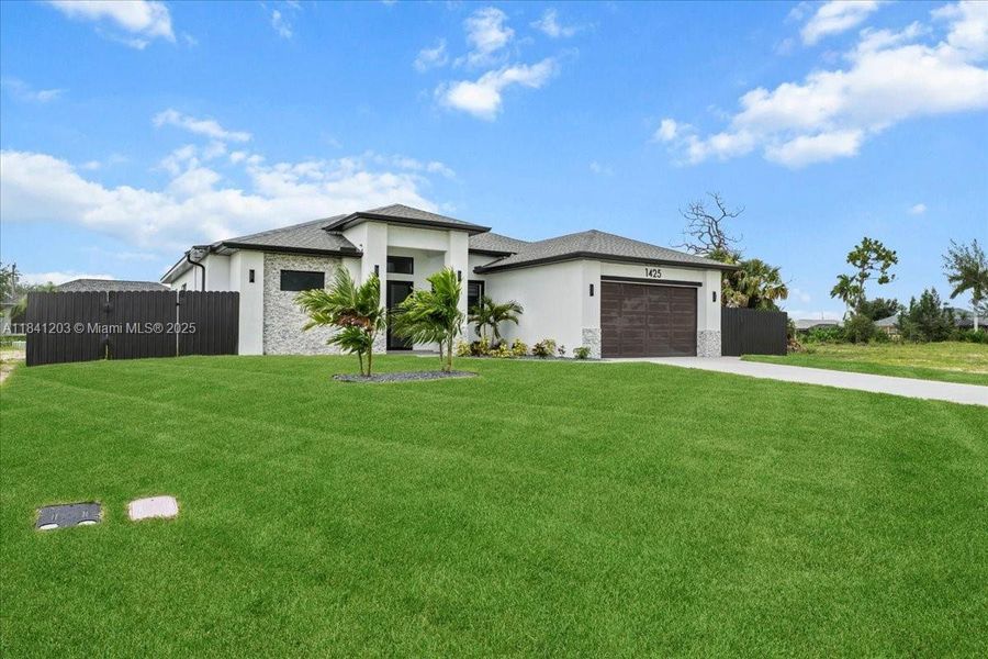 Front exterior of a new home in , Cape Coral, FL, highlighting curb appeal (Image 32). Front exterior of a new home in , Cape Coral, FL, highlighting curb appeal (Image 32).