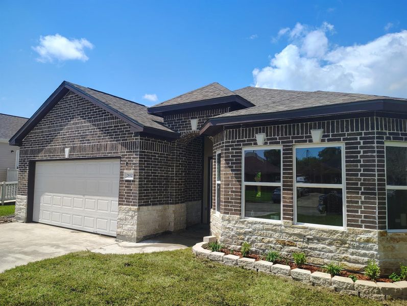 Front exterior of a new home in , La Marque, TX, highlighting curb appeal (Image 5).