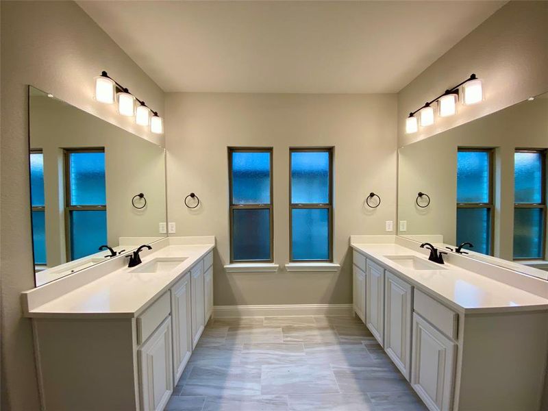 His & her vanities with quartz countertops & ORB fixtures His & her vanities with quartz countertops & ORB fixtures