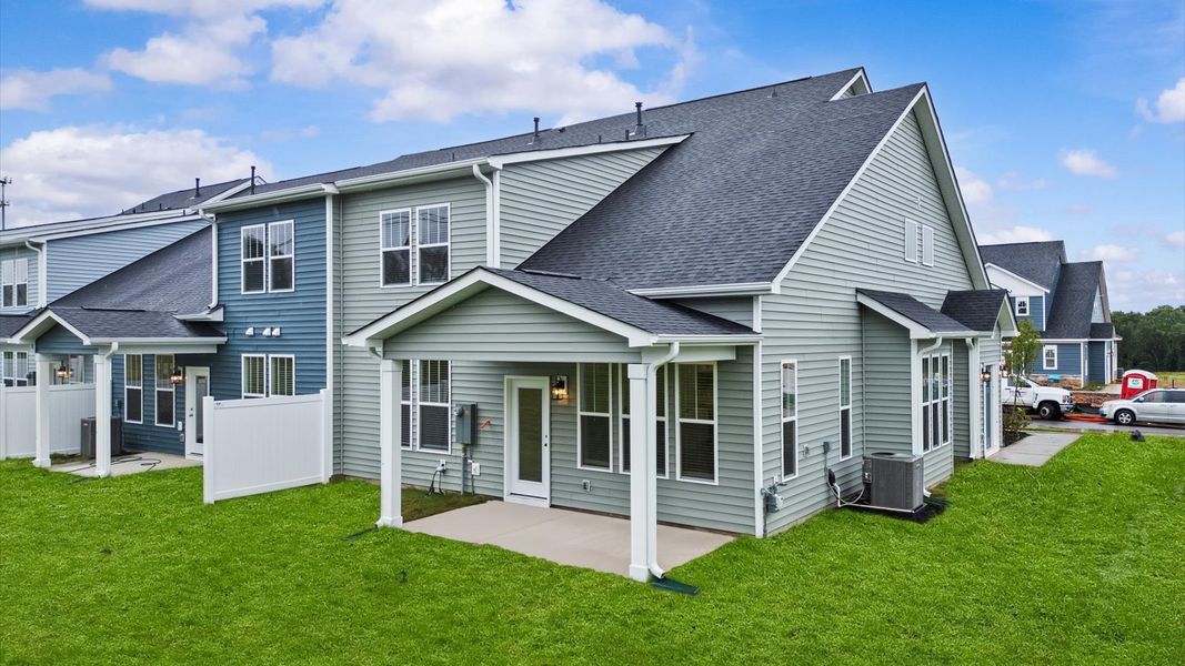 Superior curb appeal continues to the back with a refined, covered outdoor living space at Silo Ridge in Anderson, SC