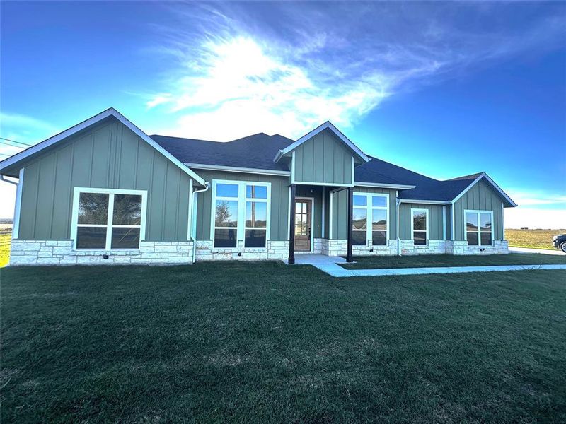 View of front of house with a front lawn