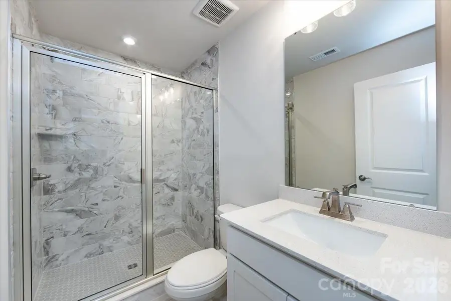 First floor bathroom with tiled walk-in shower
