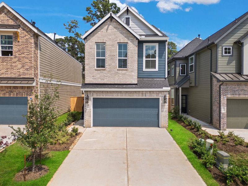 Front exterior of a new home in Meridiana, Manvel, TX, highlighting curb appeal (Image 27).