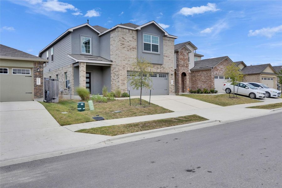 Front of home with covered entry and attached two car garage. Front of home with covered entry and attached two car garage.