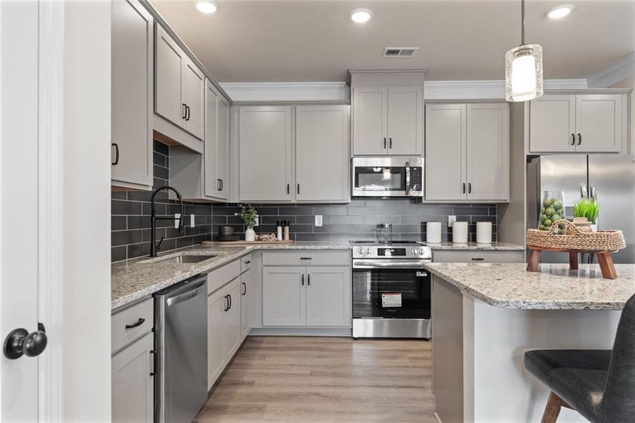 Furnished interior view inside a new home in Trinity Station, Auburn (Image 15).