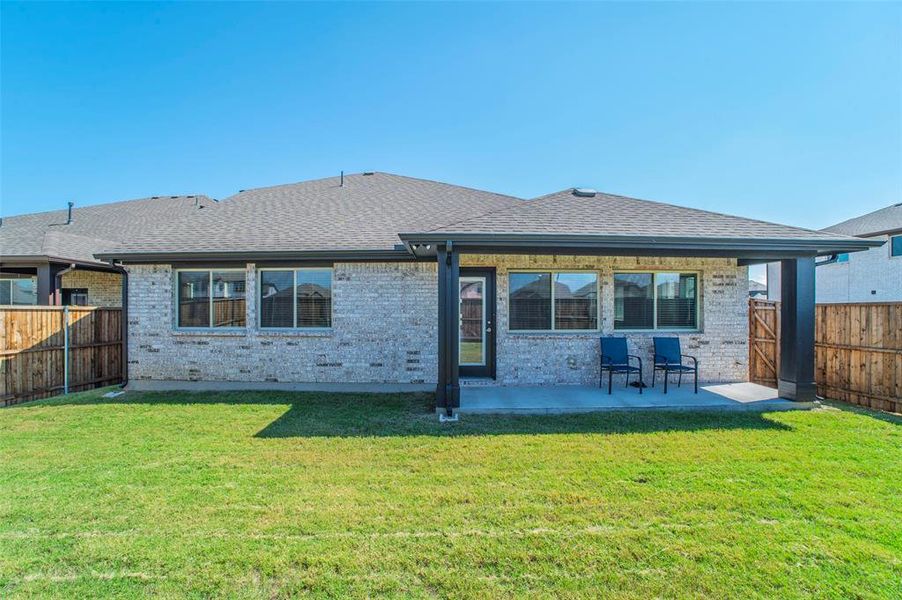 Exterior details and patio area of a home in , Aubrey (Image 3).