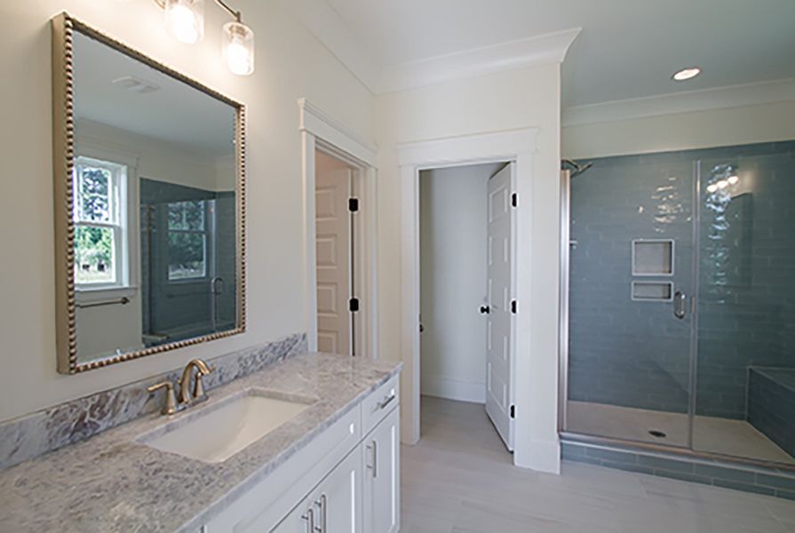 Representative furnished interior of a home built from the The Amherst by RobuckHomes in Windwater, Hampstead (Image 18).